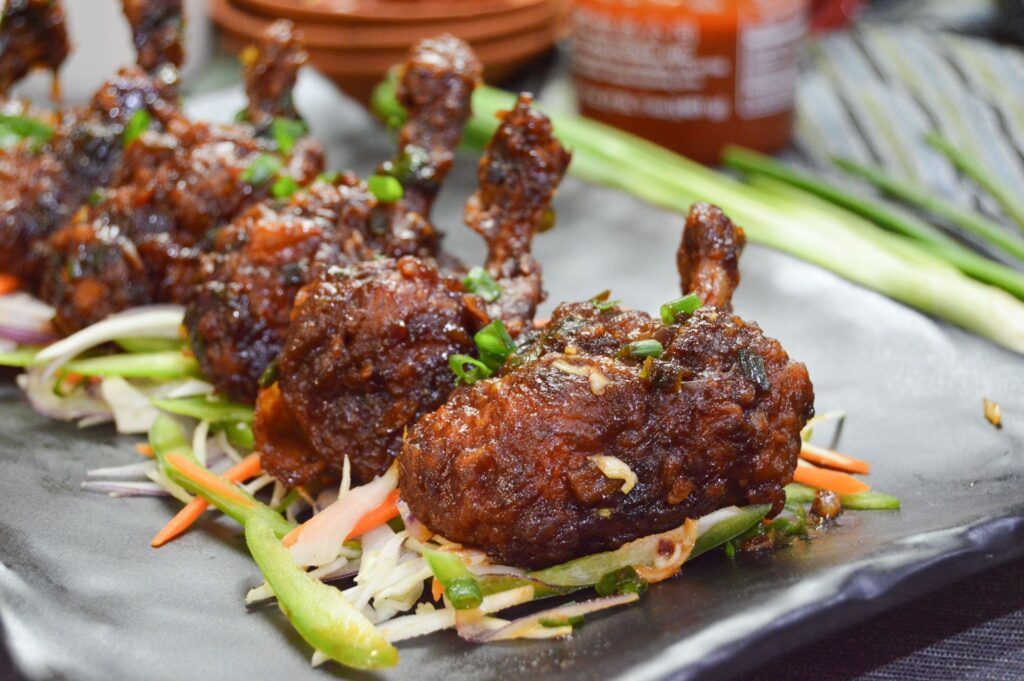 Fried Chicken Lollypop in Manchurian Sauce