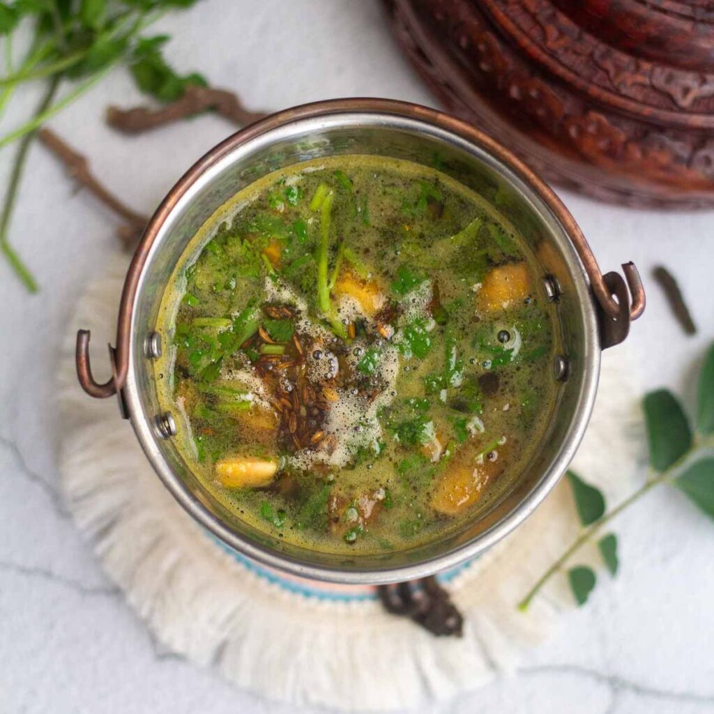 square image of thippili rasam served in small bucket