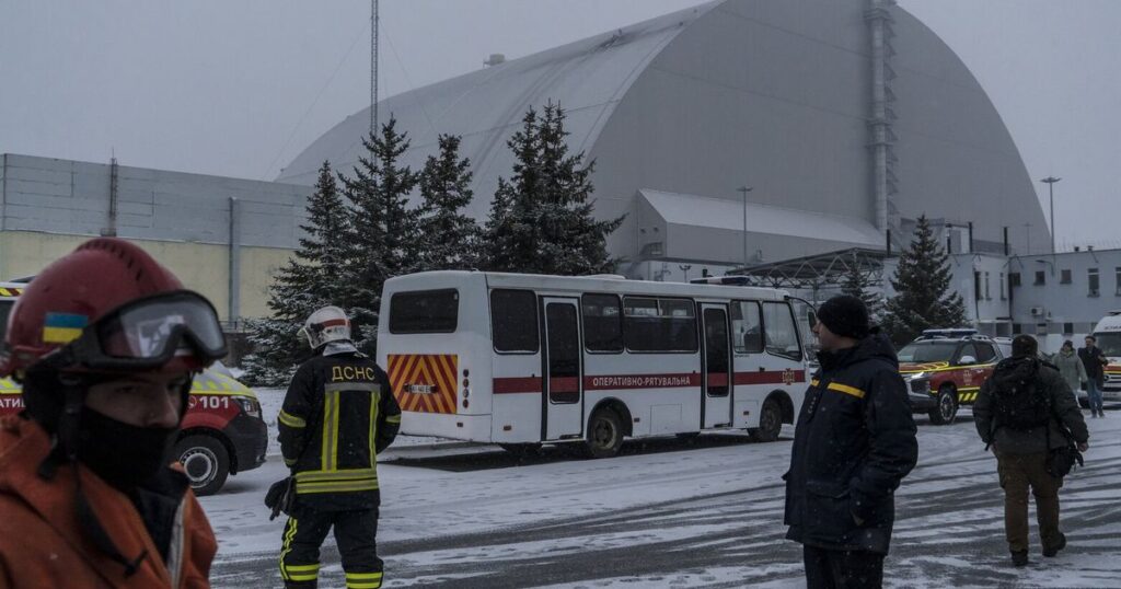 High above Chernobyl, workers grapple with ice, fire and nuclear fears