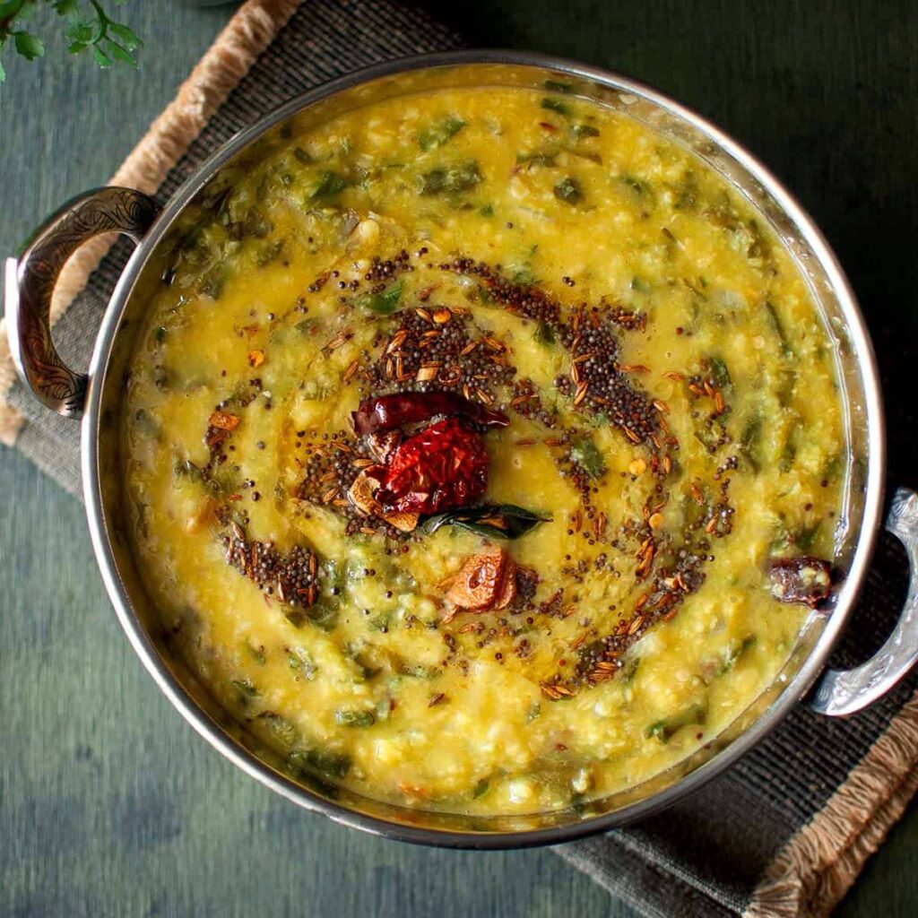 Top view of kadai with spinach dal.