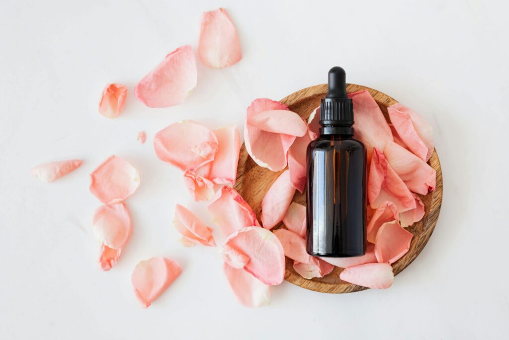 Skincare Bottle Sitting on Rose Petals