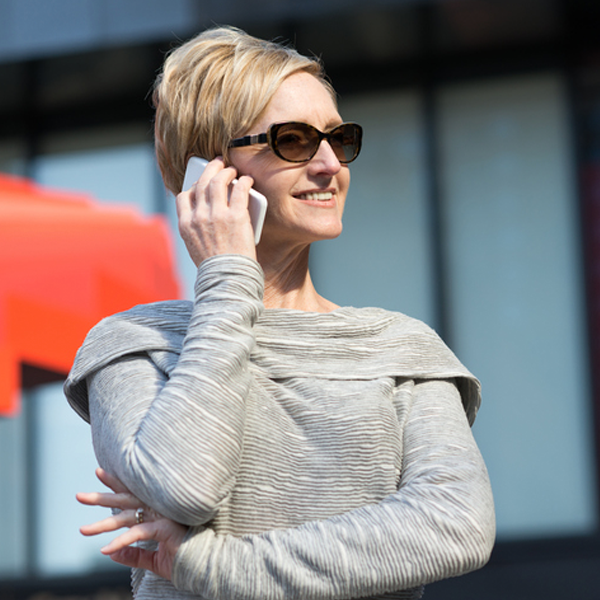 female founder on cellphone discussing funding