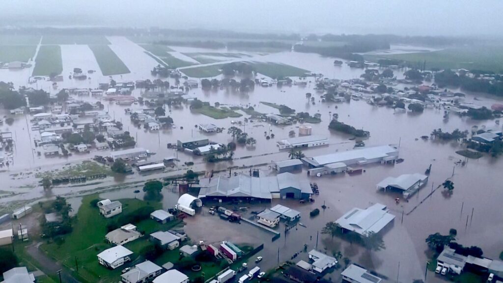 Woman dies and thousands urged to move to higher ground as 'record-breaking rainfall' hits Queensland | World News