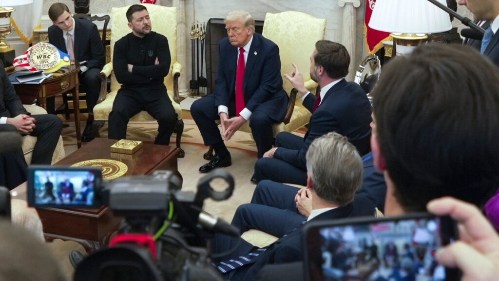 Vice President JD Vance (R) speaks with Ukrainian President Volodymyr Zelenskyy as President Donald Trump listens. Pic: AP