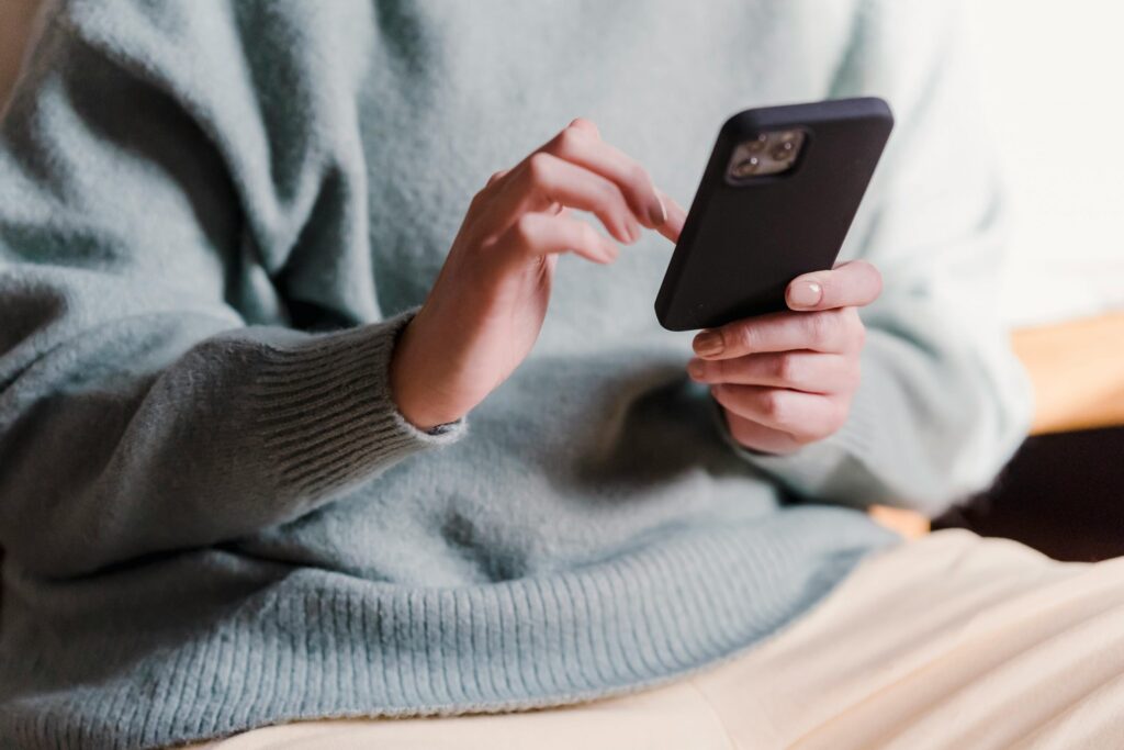 Close Up of a Woman Holding a Cell Phone