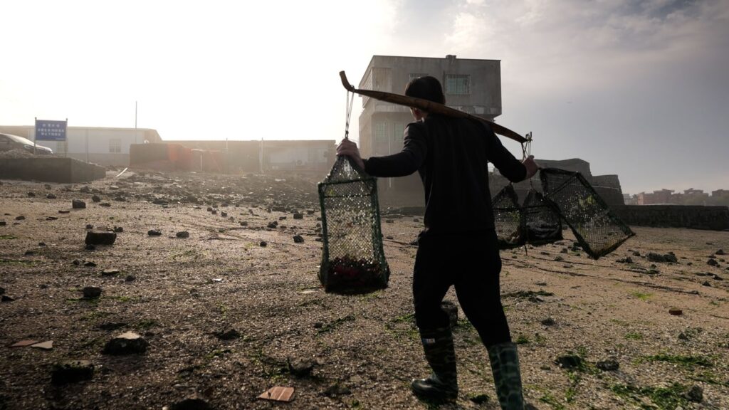 Man walking with the catch of the day