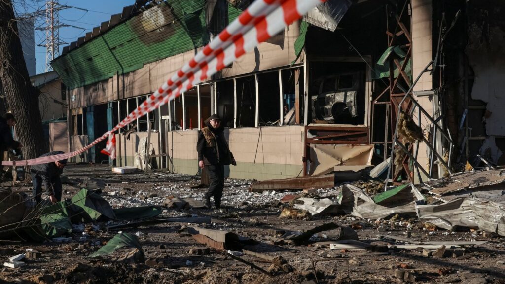 A resident walks at the site of a Russian drone strike, amid Russia's attack on Ukraine, in Odesa, Ukraine March 8, 2025. REUTERS/Nina Liashonok
