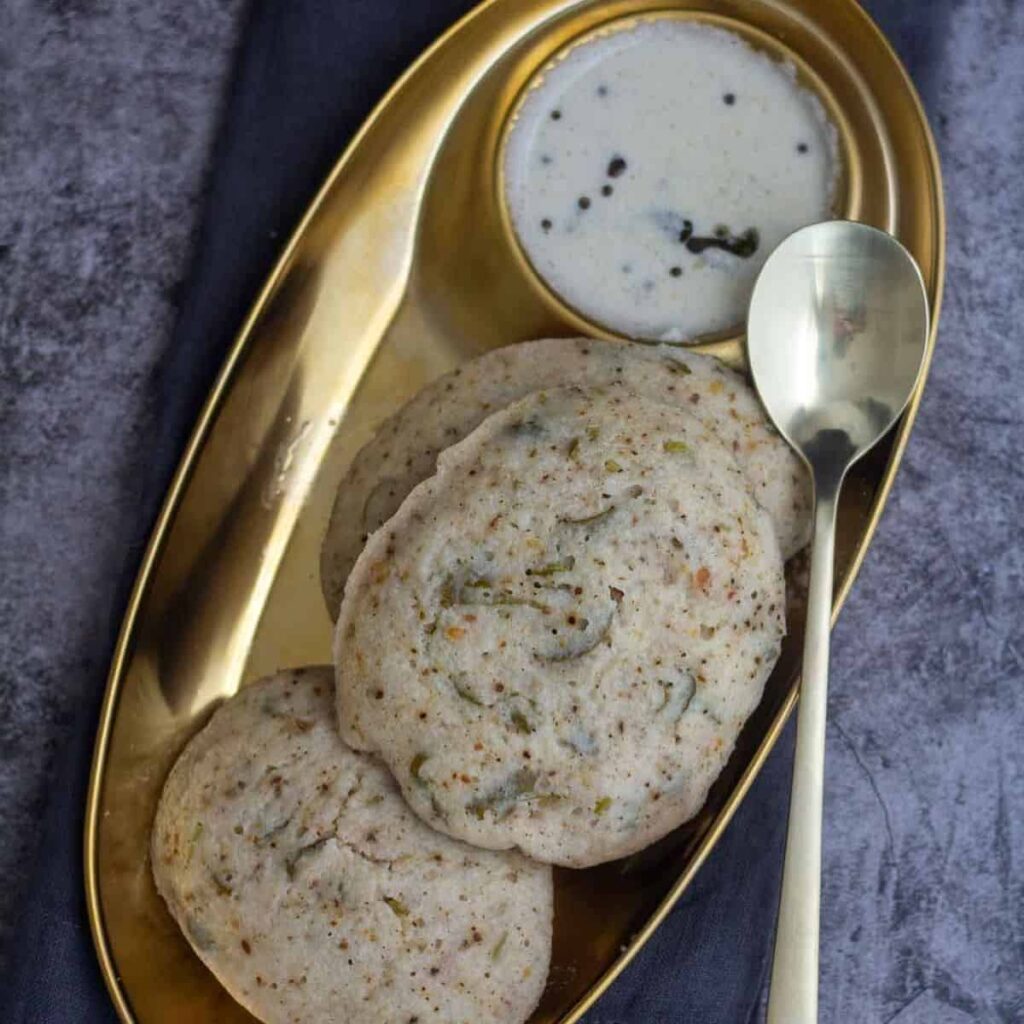 square image of kanchipuram idli with coconut chutney