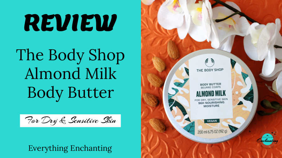 The Body Shop Almond Milk Body Butter review graphic with the product lid, almonds, and white flowers. Text reads "REVIEW The Body Shop Almond Milk Body Butter For Dry & Sensitive Skin Everything Enchanting