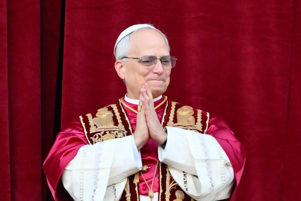 Newly elected Pope Leo XIV, Robert Prevost arrives on the main central loggia balcony of the St Peter's Basilica for the first time