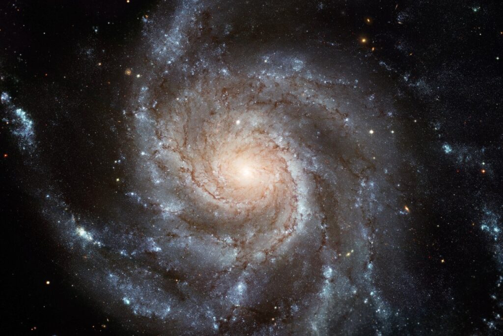 The iconic Pinwheel Galaxy, located 25 million light-years away.