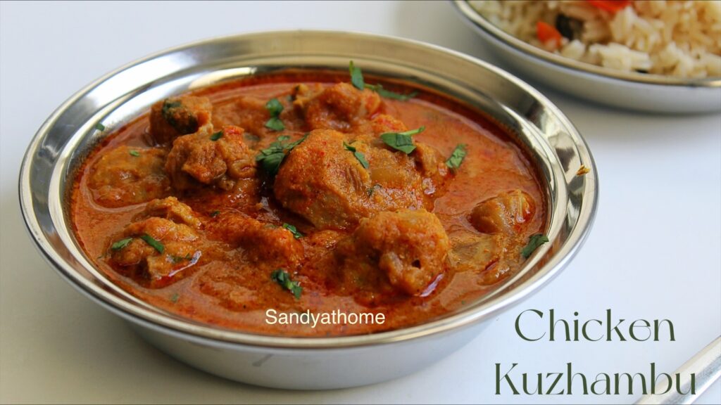 Rustic Muslim-style chicken kuzhambu in clay pot with curry leaves and coconut masala, served hot for Bakrid