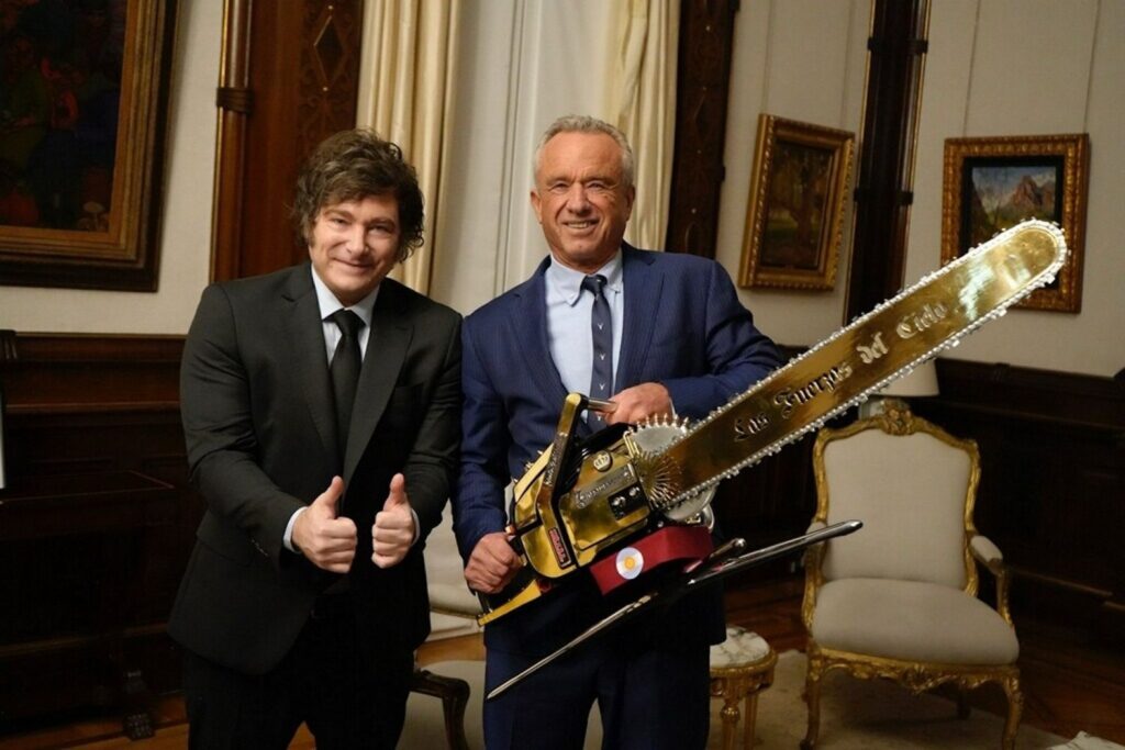 Argentina's President Javier Milei (left) and Robert F. Kennedy Jr., holding a chainsaw in a photo posted to Kennedy's X account on May 27. 2025.