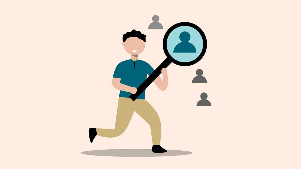 person with magnifying glass enlarging one employee silhouette - concept of finding the right employee